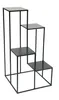 A black metal plant stand with four tiers arranged in a step-like fashion, shown against a white background. Produktbild-Vorschau