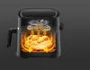 Cutaway view of a black air fryer showing fried chicken being cooked with heat circulation arrows. Produktbild-Vorschau