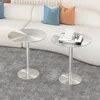 Two round metal side tables are placed on a gray carpet in front of a white sofa with blue and orange cushions. Produktbild-Vorschau