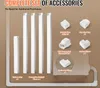A collection of white plastic accessories for a mini-split air conditioner line set cover, laid out against a light brown background. The accessories include straight pipes, joints, elbows, and a wall penetration guard. Produktbild-Vorschau