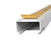A close-up, angled view of a white cable channel with a strip of adhesive tape partially peeled back. Produktbild-Vorschau