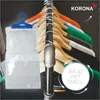 A dehumidifier bag hanging on a rack of clothes. Produktbild-Vorschau