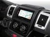 Close-up view of a car's dashboard with a navigation system and air vents. Produktbild-Vorschau