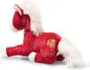 A red plush horse with a white mane and tail, lying down on a white background. It has a gold embroidered symbol on its hindquarters. Produktbild-Vorschau
