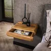 A wooden nightstand with an open drawer is mounted on a textured wall next to a bed. Produktbild-Vorschau