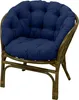 A navy blue cushion on a brown rattan chair. Produktbild-Vorschau