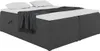A dark gray upholstered box spring bed with a white mattress and topper, and a dark gray blanket draped over it. Produktbild-Vorschau