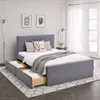 A bedroom scene with a bed and storage drawers. Voir les images du produit