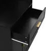 A close-up view of an open black drawer with a gold handle on a piece of furniture. Podgląd zdjęcia produktu