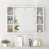 A white bathroom cabinet with a mirror and LED lights, displaying various toiletries and decorative items. Náhľad obrázku produktu