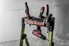 A tool stand with various tools and a drill attached, set against a wall and floor. Podgląd zdjęcia produktu