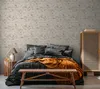 A bedroom scene with a bed, nightstand, and cabinet. Produktbild-Vorschau