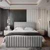 A modern bedroom with a large upholstered bed as the focal point. Produktbild-Vorschau