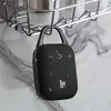 A black portable Bluetooth speaker with a carabiner hook is hanging from a shower caddy, with water droplets on the speaker and background. Voir les images du produit