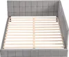 A gray upholstered bed frame with a slatted wooden base, shown from a top-down perspective. Náhled obrázku produktu