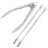 A set of seafood tools, including a crab cracker and two small forks, laid out on a white background. Podgląd zdjęcia produktu