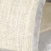 A close-up view of a cat scratching post with a textured surface and a fuzzy trim. Anteprima dell’immagine prodotto