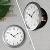 A collage of two images showing a wall clock, one with its secret compartment open. Voir les images du produit