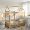A wooden bunk bed with a house-shaped frame in a child's bedroom. Produktbild-Vorschau