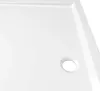 A close-up view of a white shower tray with a drain hole. Produktbild-Vorschau