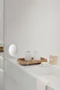 A minimalist bathroom counter with various accessories. Produktbild-Vorschau
