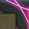 Close-up view of the corner of a gaming rug, showing the textured underside with white dots and the colorful, abstract pattern on the top side. Produktbild-Vorschau