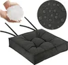 A close-up of a dark gray seat cushion with straps, next to a hand holding white filling material, and a circular inset showing water droplets on fabric. Produktbild-Vorschau
