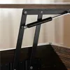 A close-up view of the lifting mechanism of a dark brown wooden coffee table. Produktbild-Vorschau