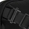 A close-up of a black bag strap with a buckle and a logo. Anteprima dell’immagine prodotto