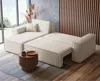A modern living room with a cream-colored sectional sofa with a pull-out bed feature, a wooden side table, and a large window overlooking a garden. Produktbild-Vorschau