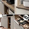 A collage of four images showing details of a bathroom vanity set, including the countertop, drawers, shelves, and interior organization. Produktbild-Vorschau