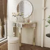 A mirrored console table with a round mirror above it, set in a room with blinds and a stool. Produktbild-Vorschau