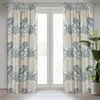 A pair of curtains with a botanical pattern hanging in front of a window. Produktbild-Vorschau