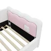 A close-up view of the headboard and slatted base of a white and pink bed frame. Náhľad obrázku produktu