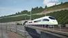 A high-speed train emerges from a tunnel on an elevated track, with a vineyard-covered hillside in the background. Náhled obrázku produktu