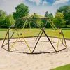 A geodesic dome climber playground structure in a park setting with sand on the ground and trees and sky in the background. Náhled obrázku produktu