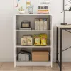 A white two-door cabinet with shelves, displaying various items like books, snacks, and decorative objects. Podgląd zdjęcia produktu