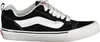 A side view of a black and white Vans sneaker. Voir les images du produit