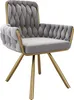 A single gray armchair with gold legs against a white background. Produktbild-Vorschau