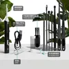 A collection of ear cleaning tools and accessories are displayed on a white surface with green foliage in the background. Produktbild-Vorschau