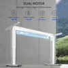 A white electric standing desk frame with a blue light tube inside, set against a concrete wall and a blurred natural landscape background. Produktbild-Vorschau