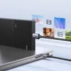 A USB-C cable connects a laptop to an external hard drive, with floating images of media content in the background. Anteprima dell’immagine prodotto