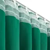 A close-up view of several green curtains hanging from a track. Produktbild-Vorschau