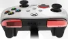 A white Xbox controller with red accents is shown from a bottom-up perspective against a white background. Produktbild-Vorschau