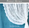 A close-up of a white lace curtain with a floral pattern and a wavy edge, draped against a teal background. Produktbild-Vorschau