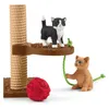 Two toy kittens playing with a scratching post, a ball of yarn, and a string. Anteprima dell’immagine prodotto