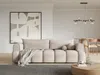 A modern living room with a taupe sofa, a large abstract painting, and a dining area in the background. Produktbild-Vorschau