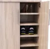 A close-up view of an open shoe cabinet with shelves holding shoes. Podgląd zdjęcia produktu