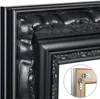 Close-up of a black ornate picture frame corner, showing decorative details and a hanging mechanism. Produktbild-Vorschau