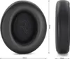 Two black ear pads for headphones are shown, one from the front and one from the side, with dimensions indicated. Podgląd zdjęcia produktu